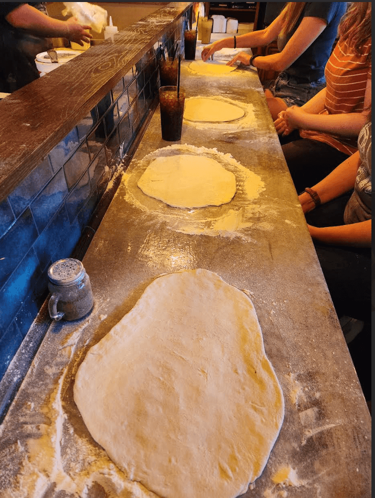 Pizza dough stations ready for a Lollipops pizza class